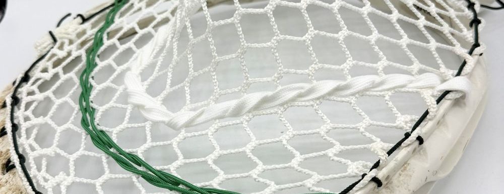 Lacrosse stick with white mesh stringing