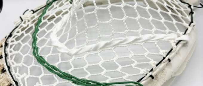 Lacrosse stick with white mesh stringing
