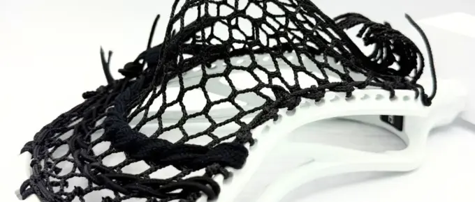 lacrosse head setup with white ecd dna 2.0 and black hero 4.0 mesh, designed for defensive middies battling in transition