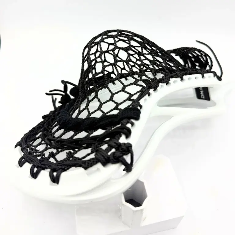 hero 4.0 semi soft mesh strung in a mid-high pocket on white ecd dna 2.0 head with black sidewalls and nylons for rugged midfield performance
