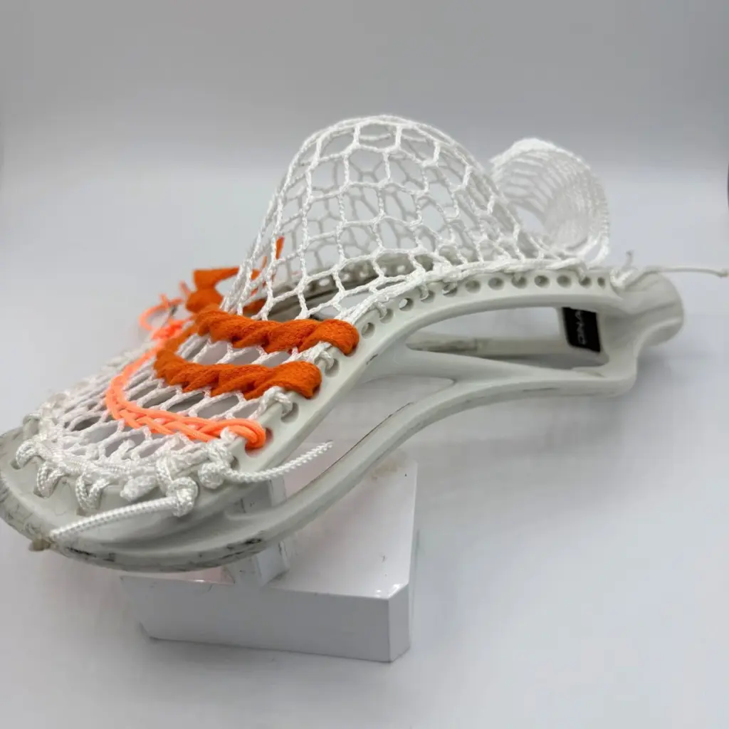 Front view of ECD Hero 4.0 Semi-Soft mesh string job on an ECD DNA 2.0 lacrosse head