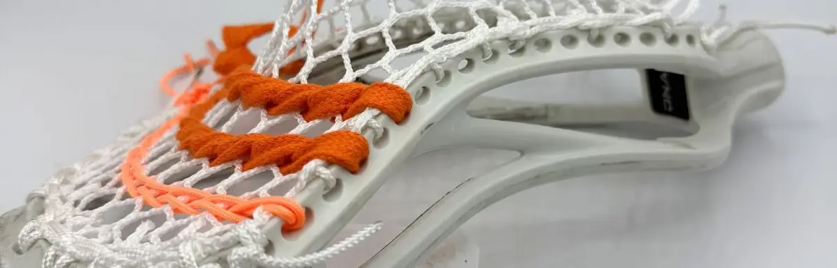 Front view of ECD Hero 4.0 Semi-Soft mesh string job on an ECD DNA 2.0 lacrosse head