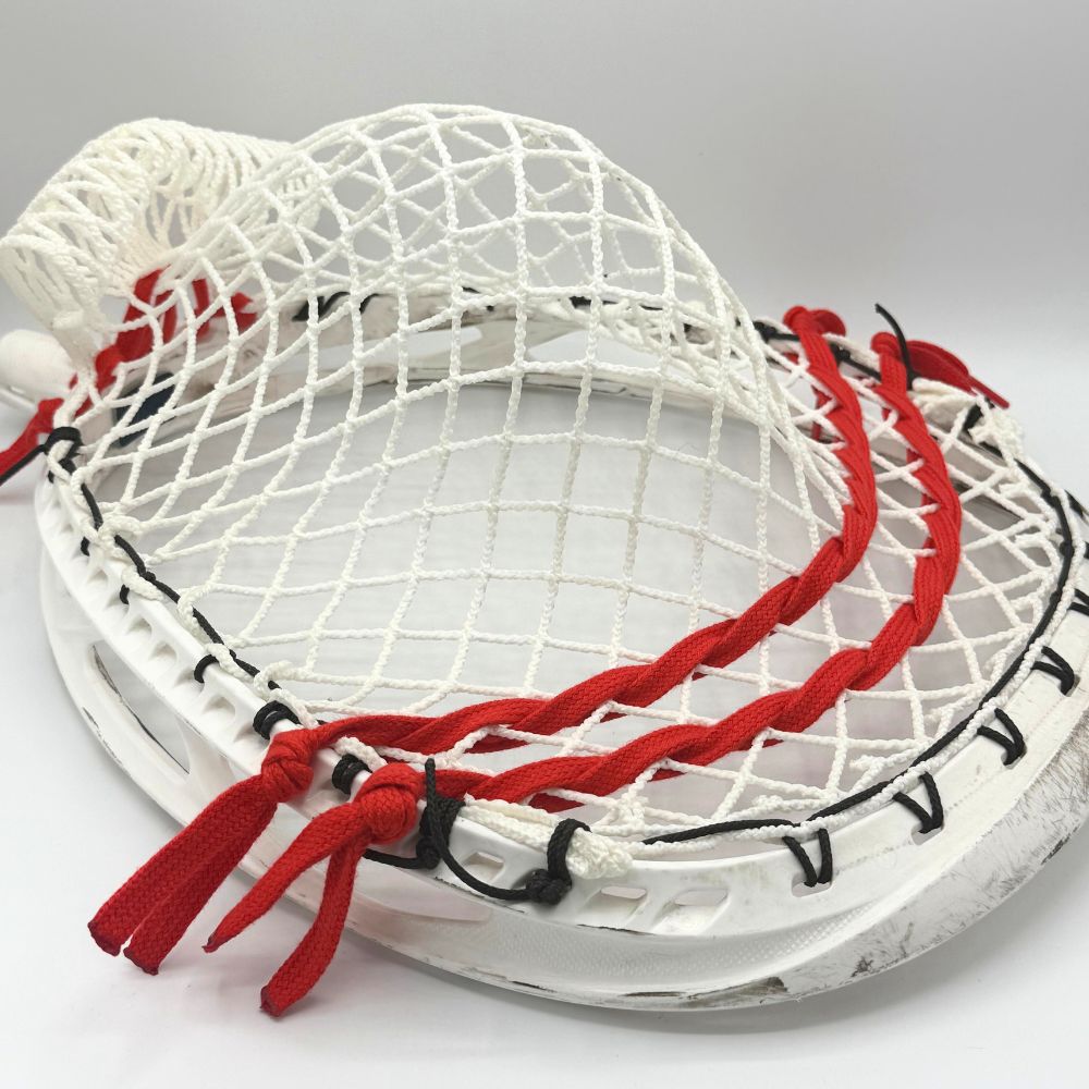 ECD Impact goalie head strung with wide, deep baggy pocket using semi-soft Impact mesh
