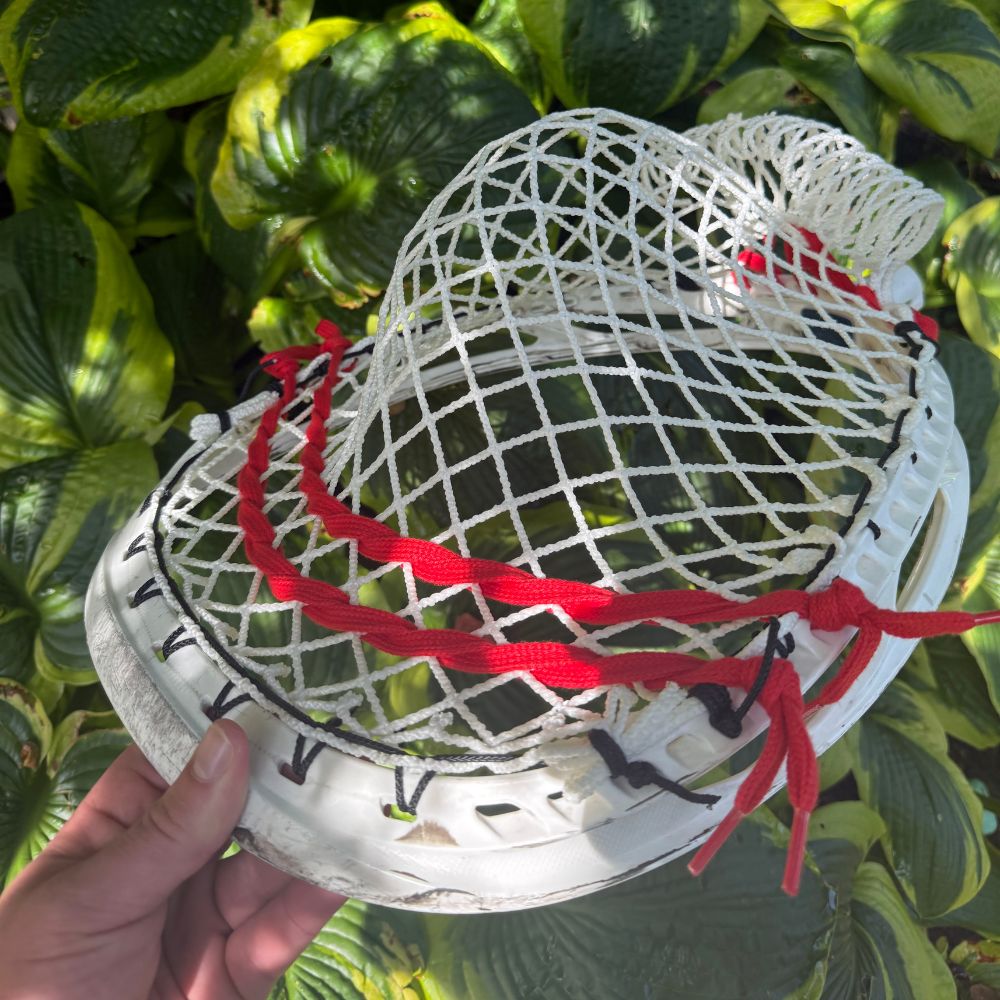 ECD Impact goalie head strung with wide, deep baggy pocket using semi-soft Impact mesh