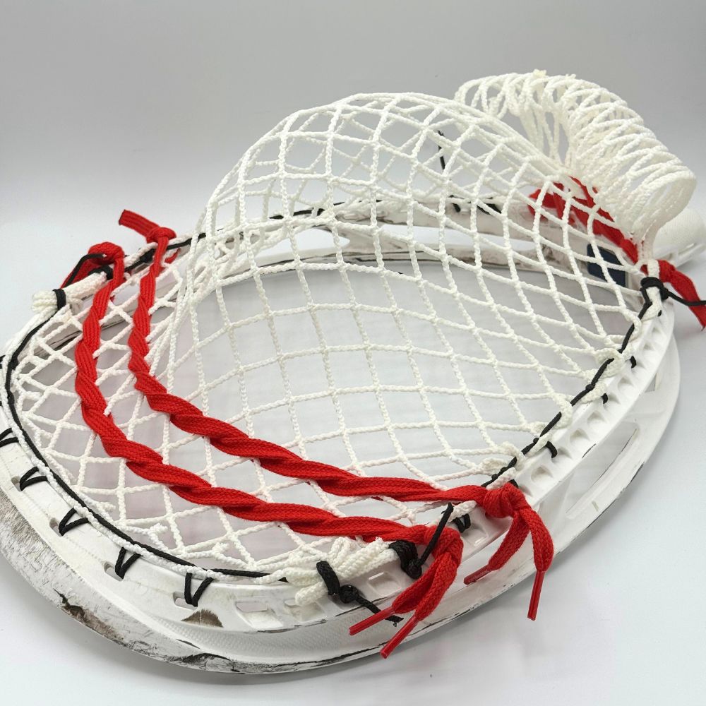 ECD Impact goalie head strung with wide, deep baggy pocket using semi-soft Impact mesh