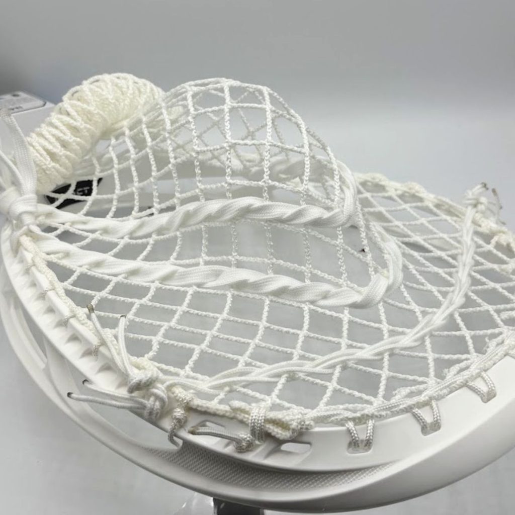 white ecd impact goalie head strung with ecd impact 12d semisoft mesh, angled view of the goalie pocket
