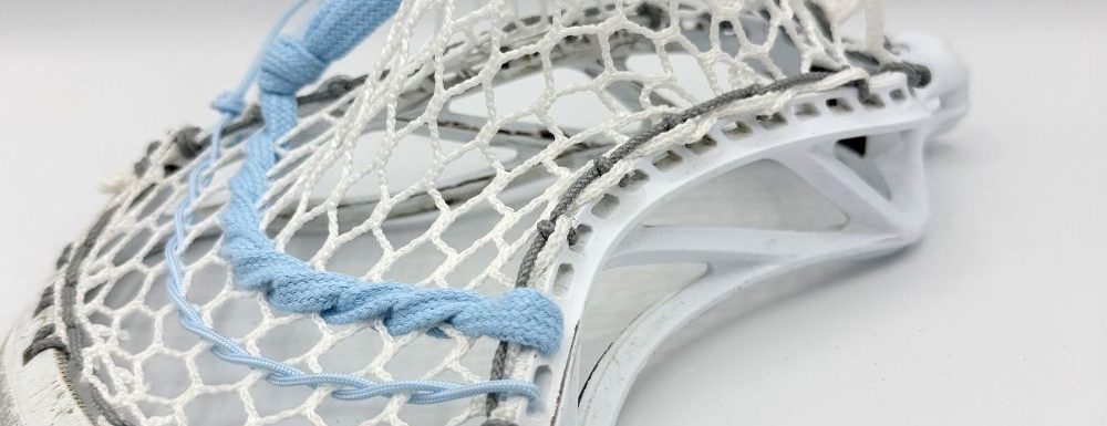 Lacrosse stick with unique stringing design.