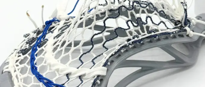 Lacrosse stick with intricate stringing