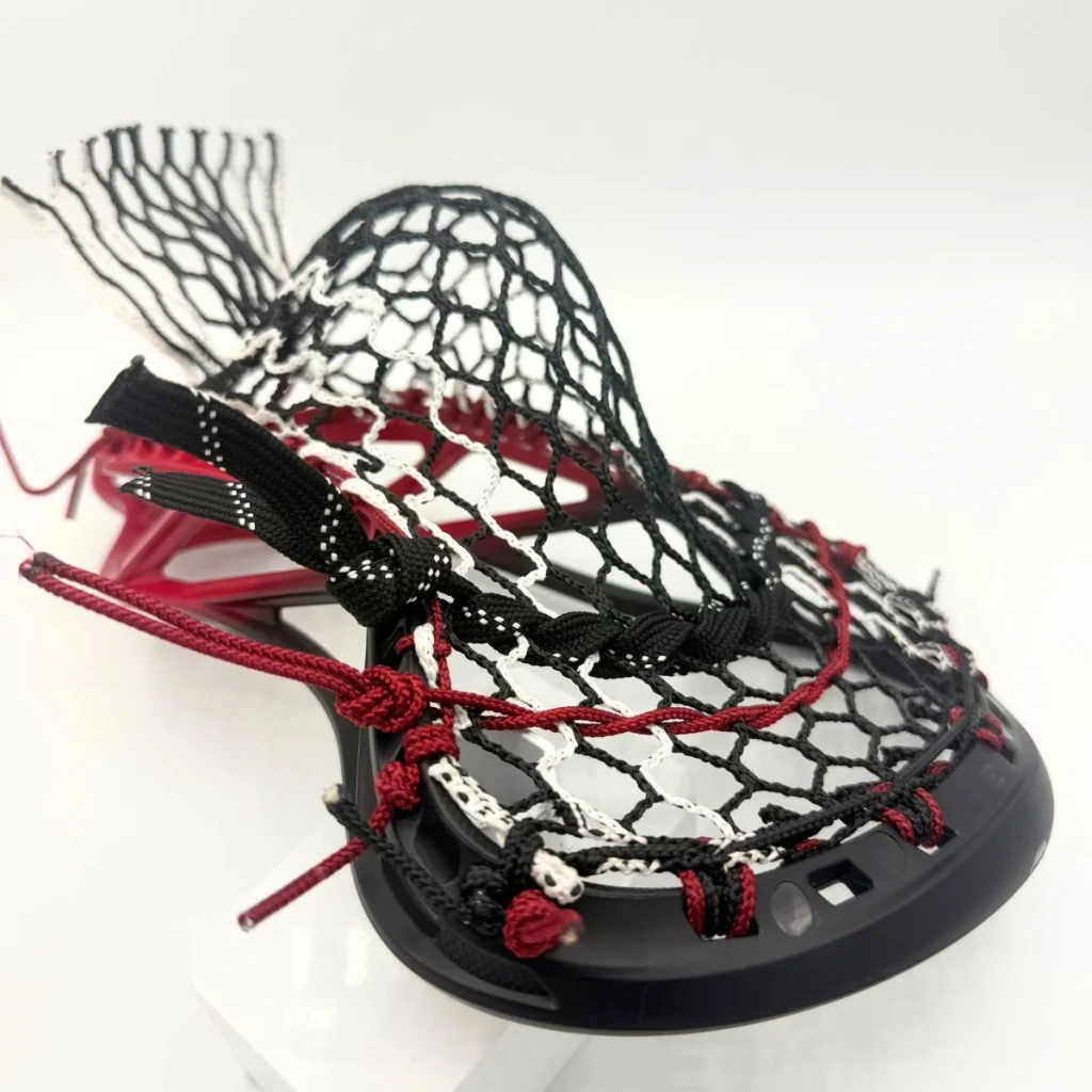 ecd mirage 3.0 box lacrosse head strung with hero 3.0 semisoft mesh in a mid pocket for youth midfielder