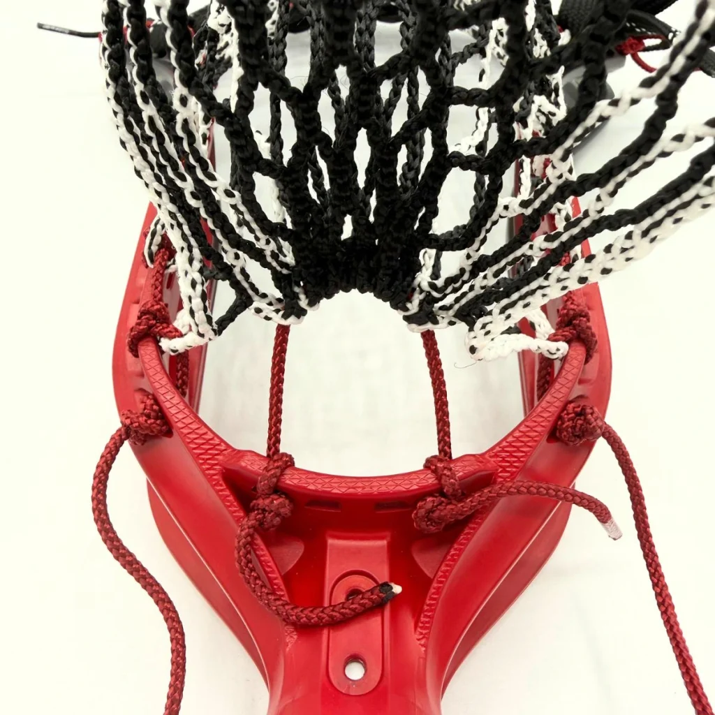ecd mirage 3.0 box lacrosse head strung with hero 3.0 semisoft mesh in a mid pocket for youth midfielder