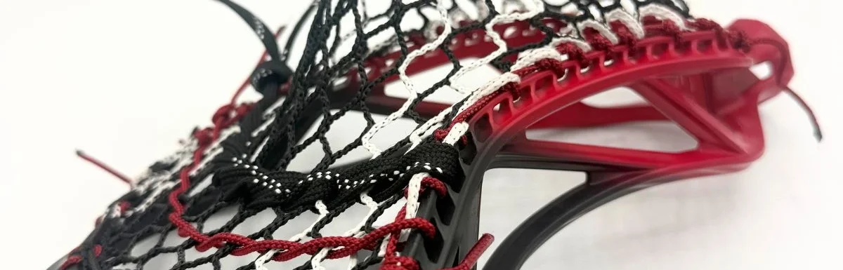 ecd mirage 3.0 box lacrosse head strung with hero 3.0 semi-soft mesh in a mid pocket for youth midfielder