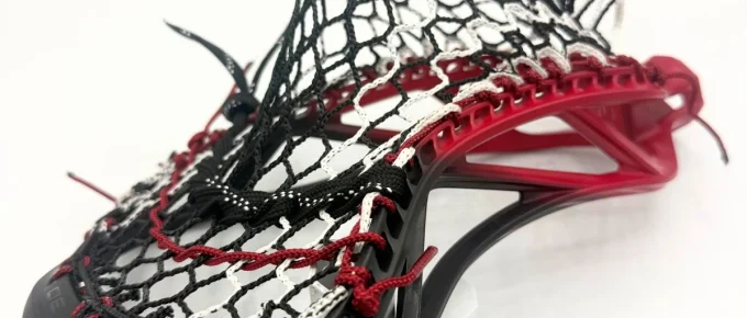 ecd mirage 3.0 box lacrosse head strung with hero 3.0 semi-soft mesh in a mid pocket for youth midfielder