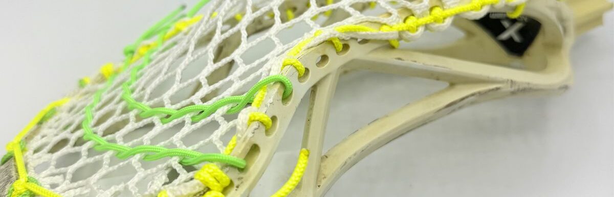 Custom strung ECD Weapon X lacrosse head featuring a mid-low pocket channel with white Hero X faceoff mesh.