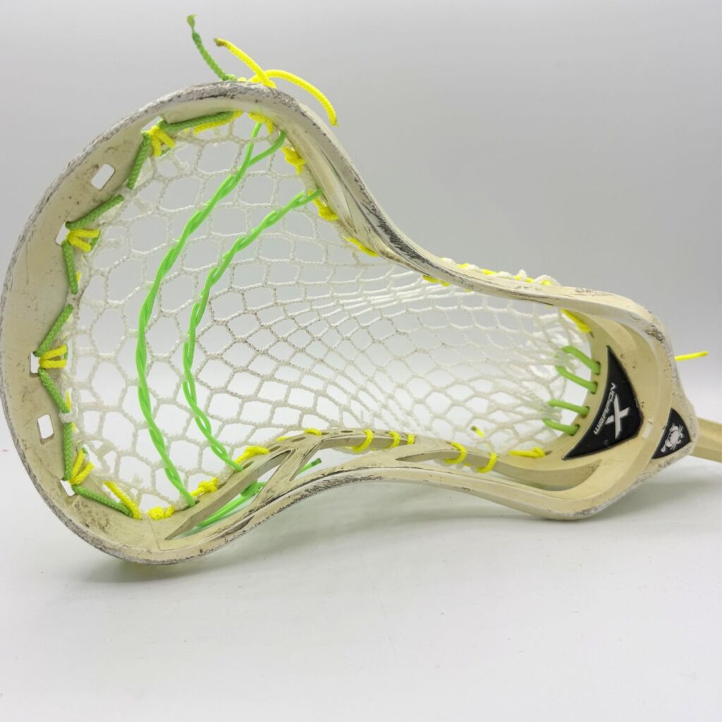 Custom strung ECD Weapon X lacrosse head featuring a mid-low pocket channel with white Hero X faceoff mesh.