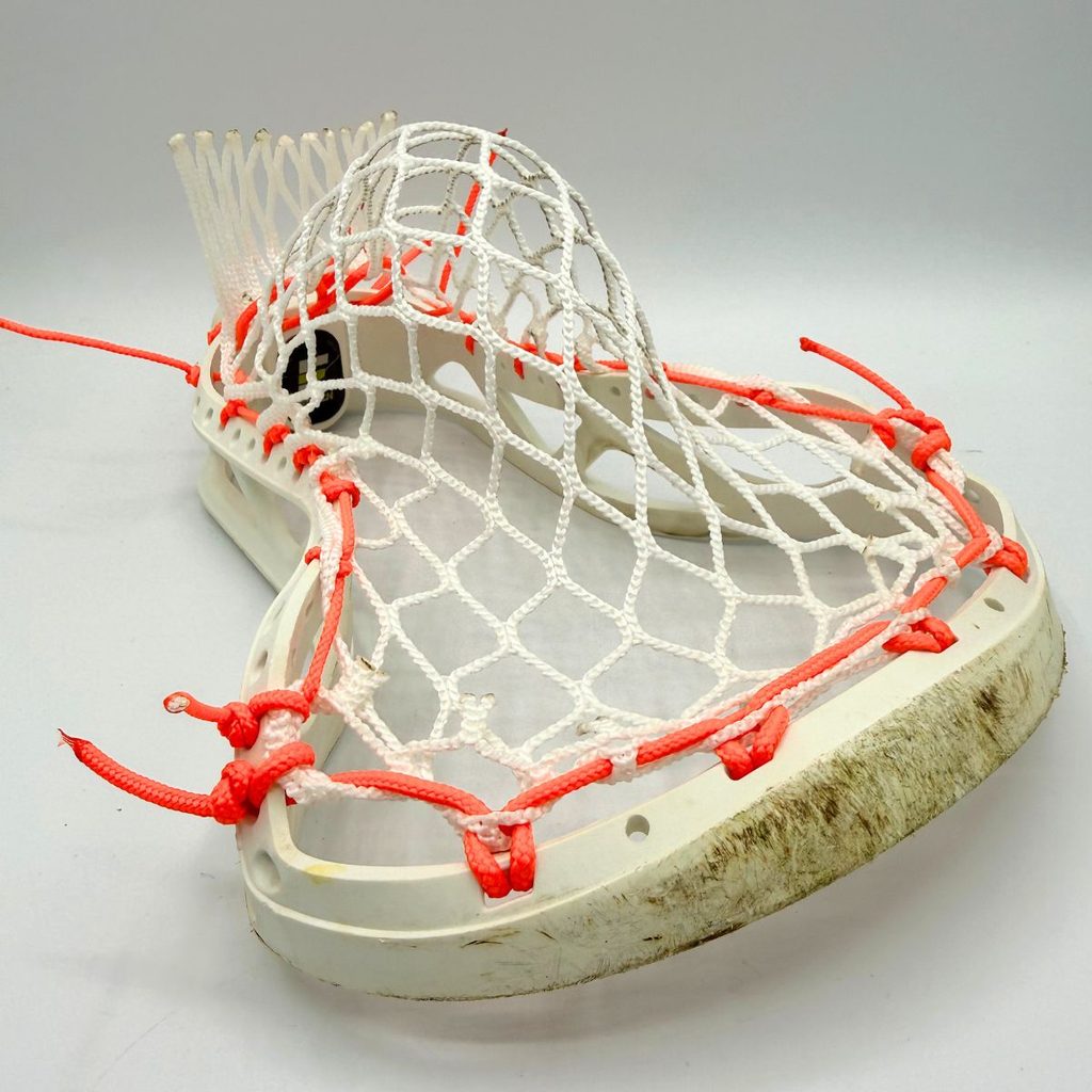 angled view of epoch hawk midhigh pocket in white laxroom 8d mesh with neon orange sidewall string