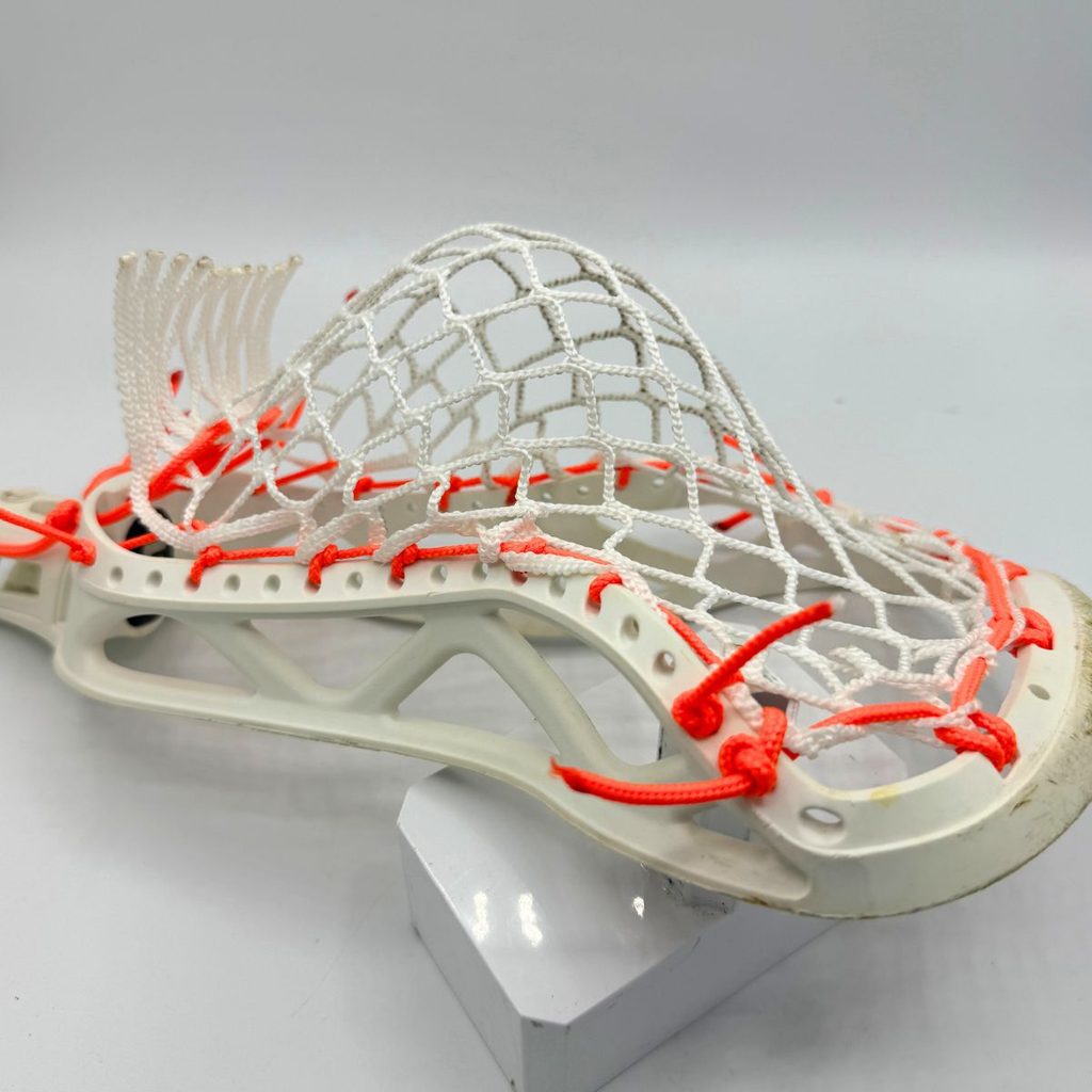 side view of epoch hawk laidback sidewall strung with laxroom 8diamond mesh and neon orange sidewall