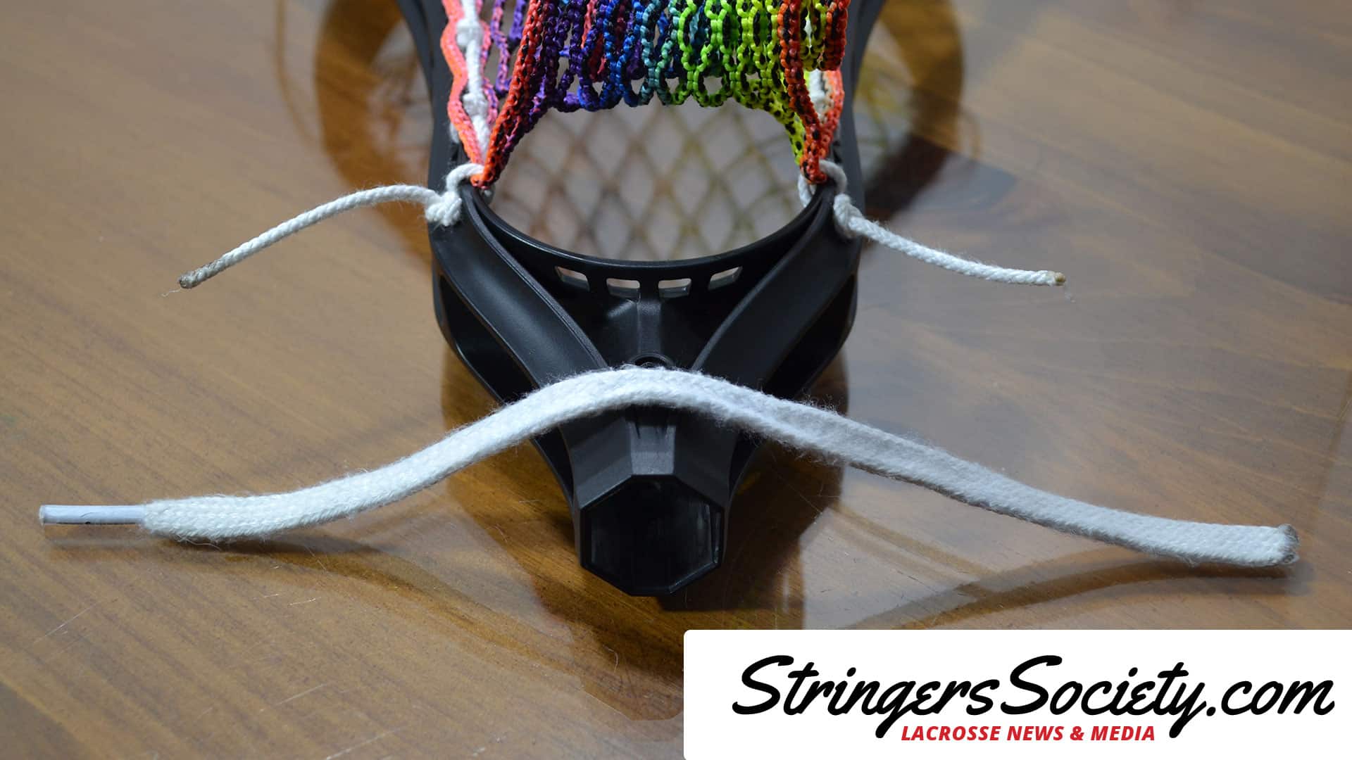 How to String a Women's Lacrosse Head how to string bottom string lacrosse step 1