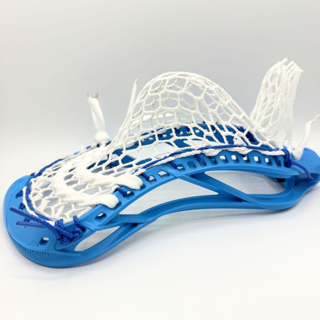 Maverik Optik Force lacrosse head with ECD Hero 4 Semi-Soft mesh mid pocket - low side angle showing pocket depth and blue sidewall string