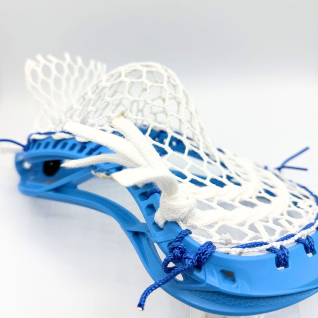 Maverik Optik Force strung with ECD Hero 4 Semi-Soft mesh - close front angle showing white shooting strings and blue sidewall knots