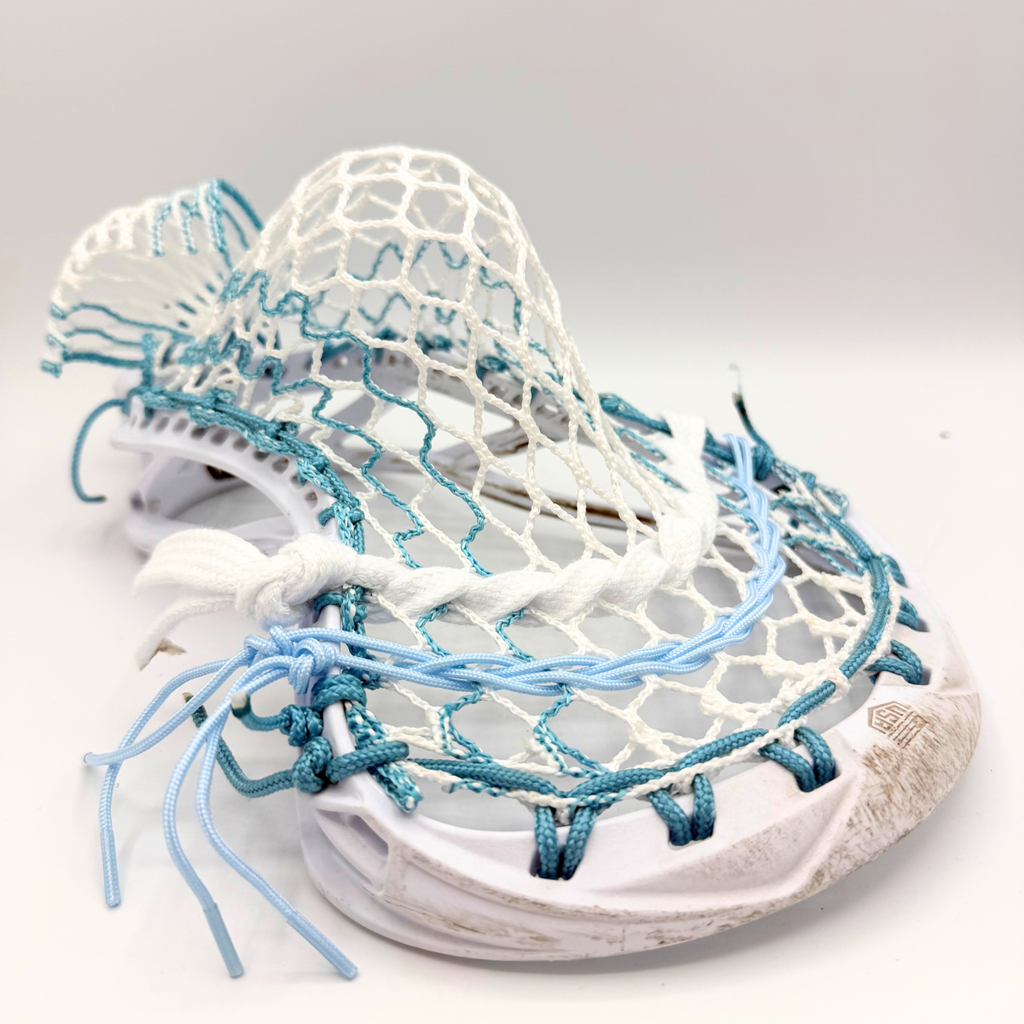 white maverik tactik 3.0 head strung with white and teal ecd hero 4.0 semisoft mesh, teal sidewall, and light blue shooters
