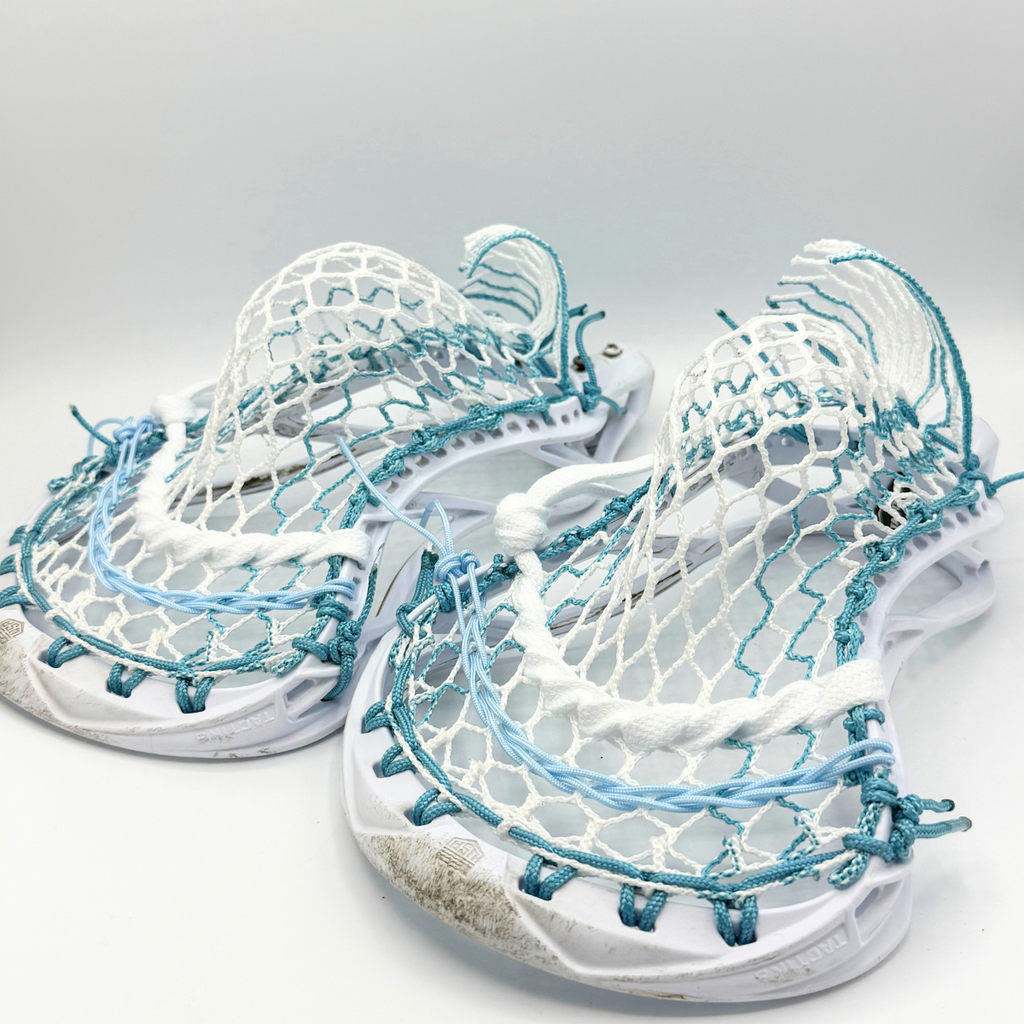two maverik tactik 3.0 heads strung with ecd hero 4.0 semisoft mesh in matching mid pockets with teal and light blue strings