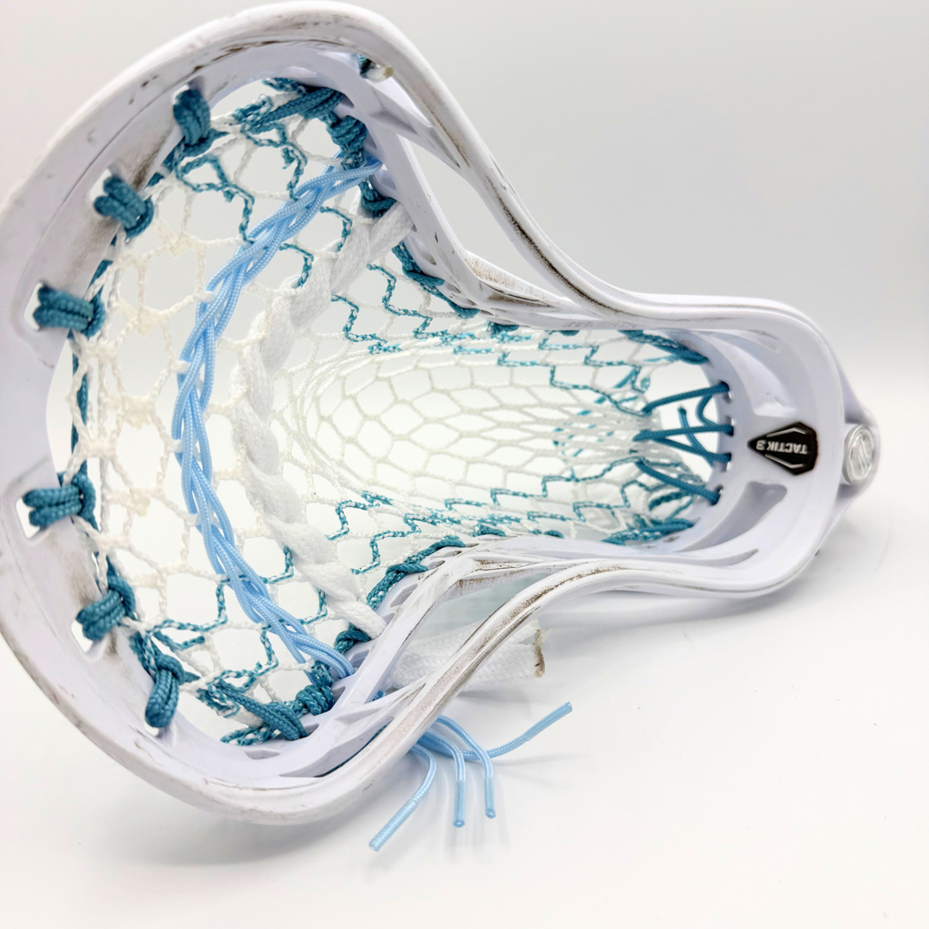 top view of maverik tactik 3.0 mid pocket showing ecd hero 4.0 mesh, light blue shooting strings, and a white lace shooter