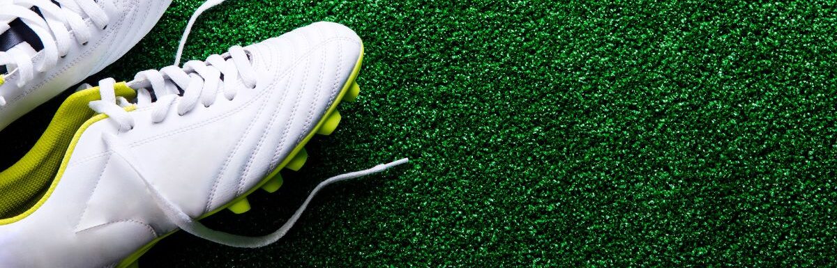 soccer cleats on turf
