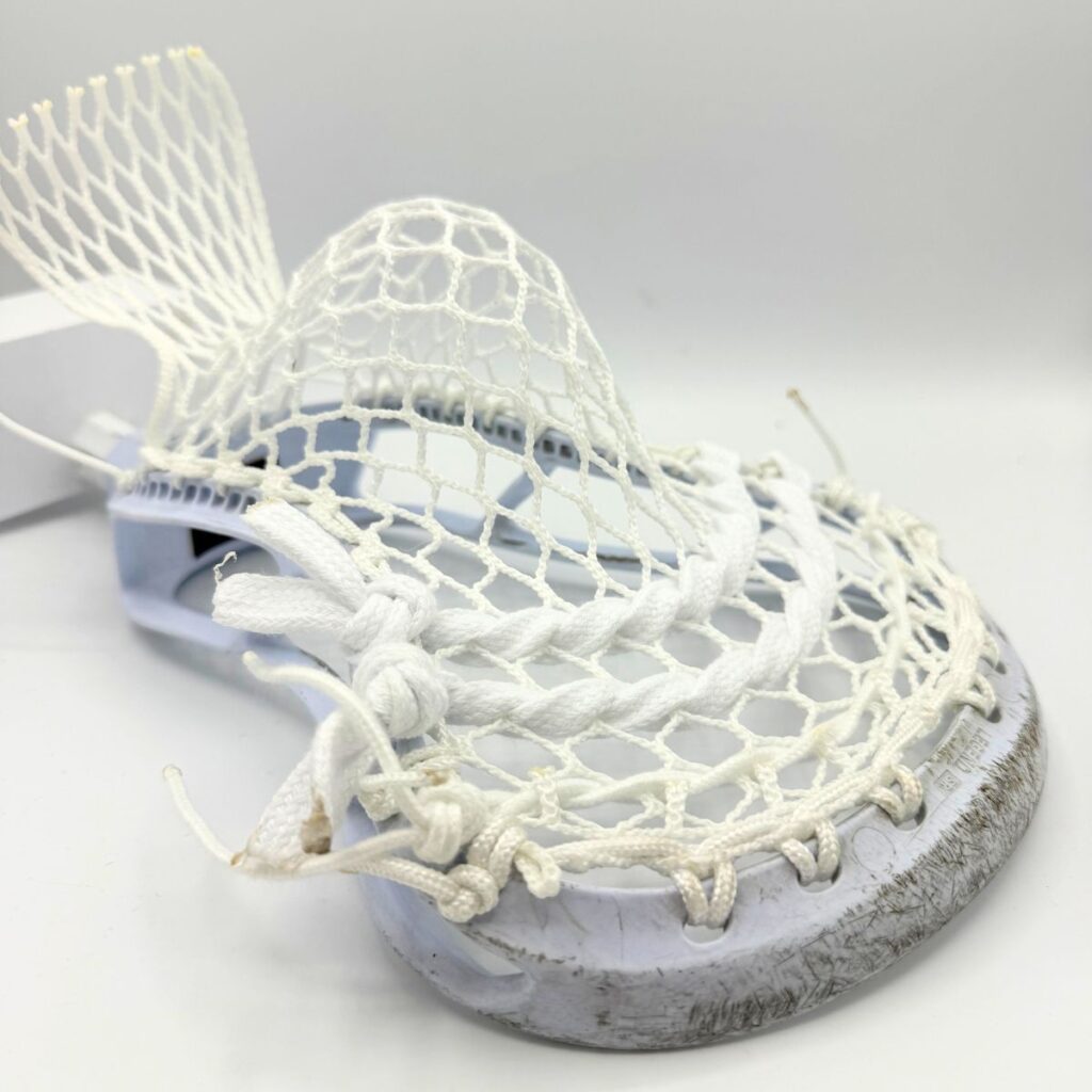 Professional-grade StringKing Legend Senior midfield stick with high-hold Hero 4.0 mesh stringing for power shooters