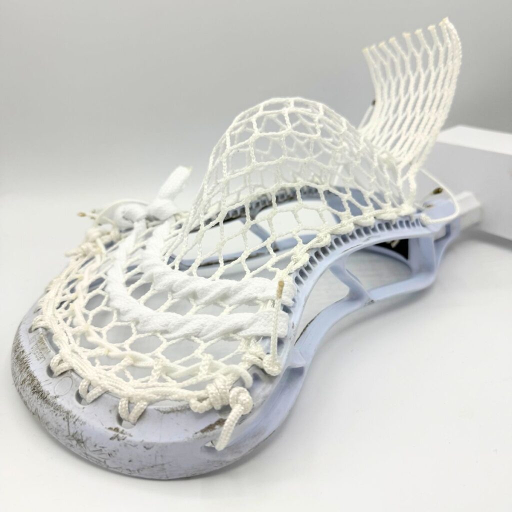 StringKing Legend Senior strung with ECD Hero 4.0 Semi-Soft mesh, showing the stiff sidewall and narrow face shape