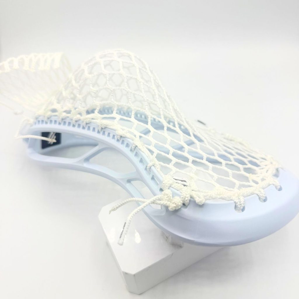 side view of white stringking mark 2f faceoff head strung with ecd hero x semisoft mesh in a midlow pocket