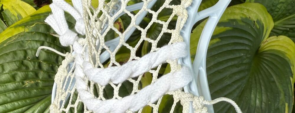 Lacrosse head with white stringing