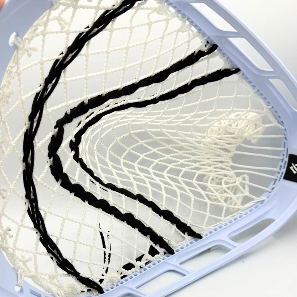 hands stringing ecd impact mesh into a stringking mark 2g head