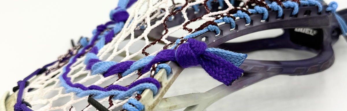 side profile of an stx duel iii low pocket with carolina blue sidewall and hero 4.0 mesh
