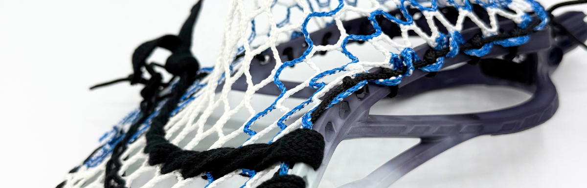 stx duel iii mid-low faceoff pocket with hero 4.0 semi-soft mesh, angled view from the scoop