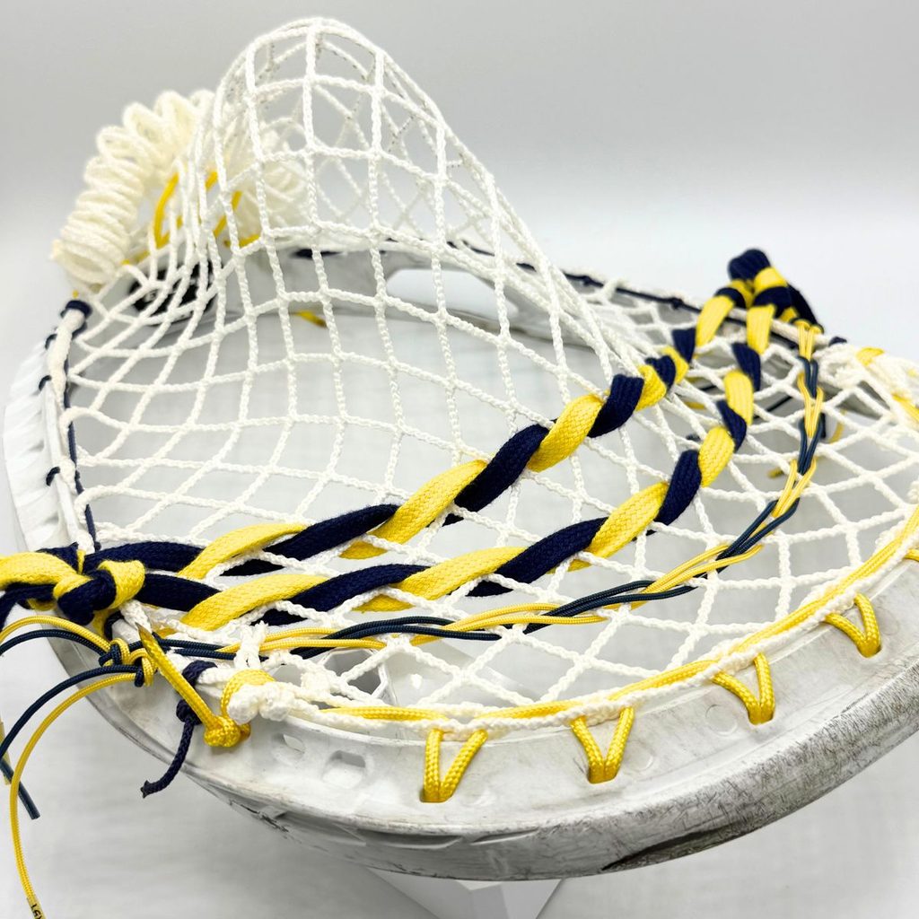 stx eclipse ii goalie head strung with white ecd impact 12d semisoft mesh, yellow sidewall and navy and yellow twisted shooting strings