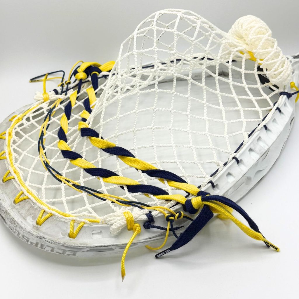 side view of stx eclipse ii goalie head with ecd impact 12d semisoft mesh, yellow sidewall and laxroom navy and yellow lace shooters