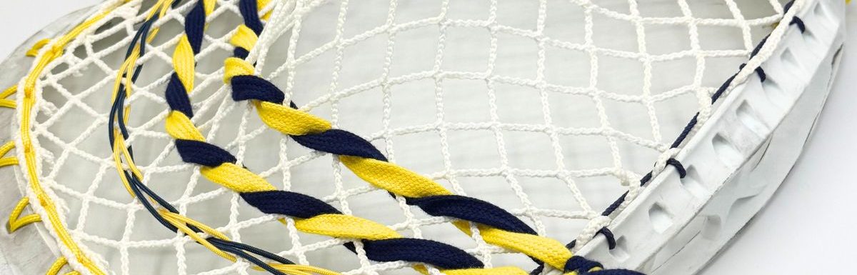stx eclipse ii goalie stringing pattern with ecd impact 12d semi-soft mesh, yellow sidewall, navy and yellow nylons and laxroom lace shooters