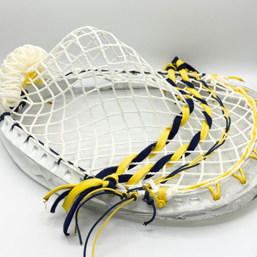 stx eclipse ii strung with white ecd impact 12d semisoft mesh, navy sidewall on the throat side and twisted navy and yellow shooting strings