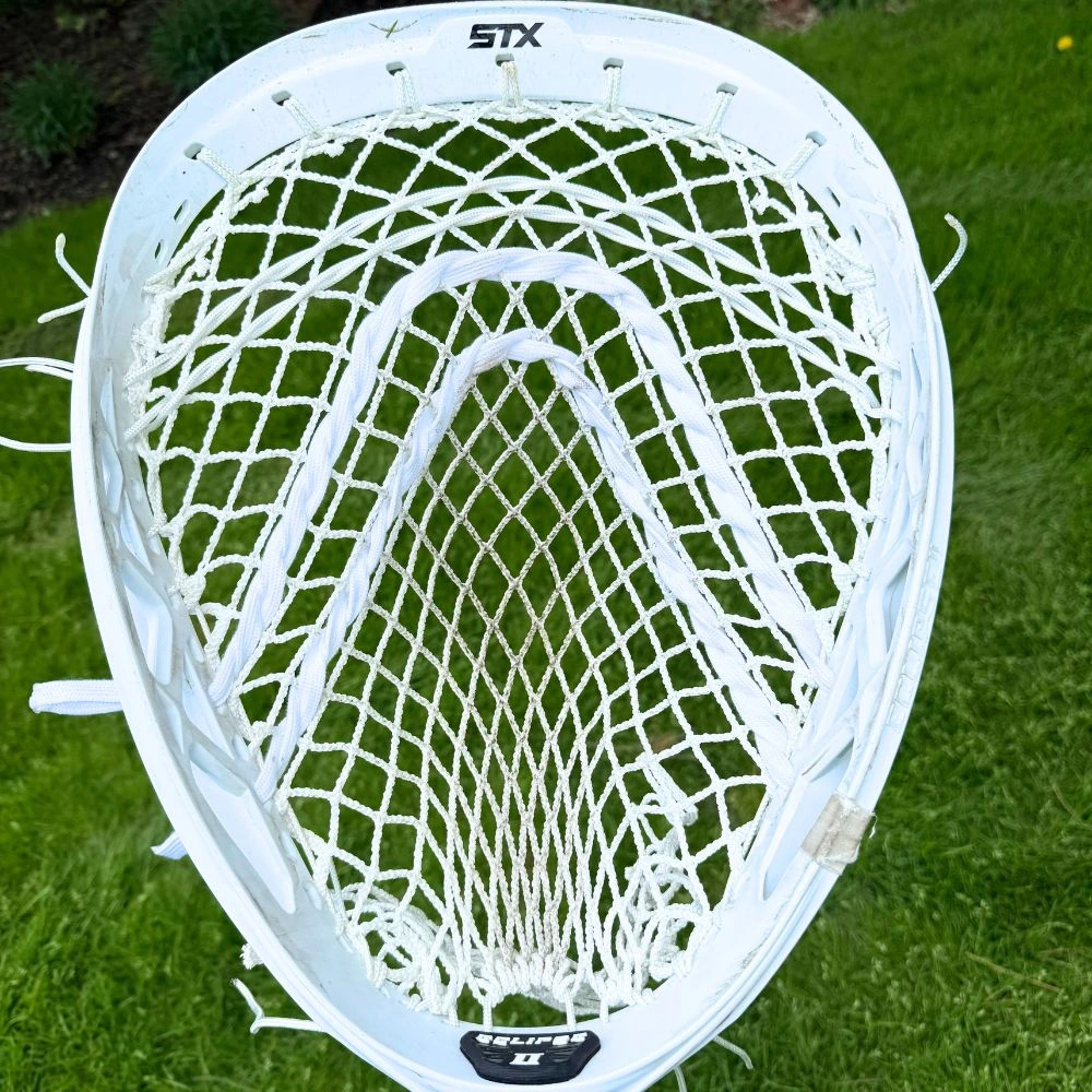 White STX Eclipse II goalie head featuring a white StringKing Grizzly 2 mesh pocket with 2 u shooting strings and two nylons