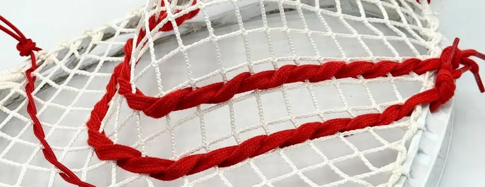 Lacrosse goalie stick with red accents