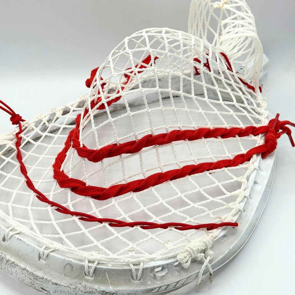 stx eclipse 3 lacrosse goalie head strung with white stringers shack g3 12d mesh, red shooting strings from laxroom, and red stringers shack bottom string and nylon.
