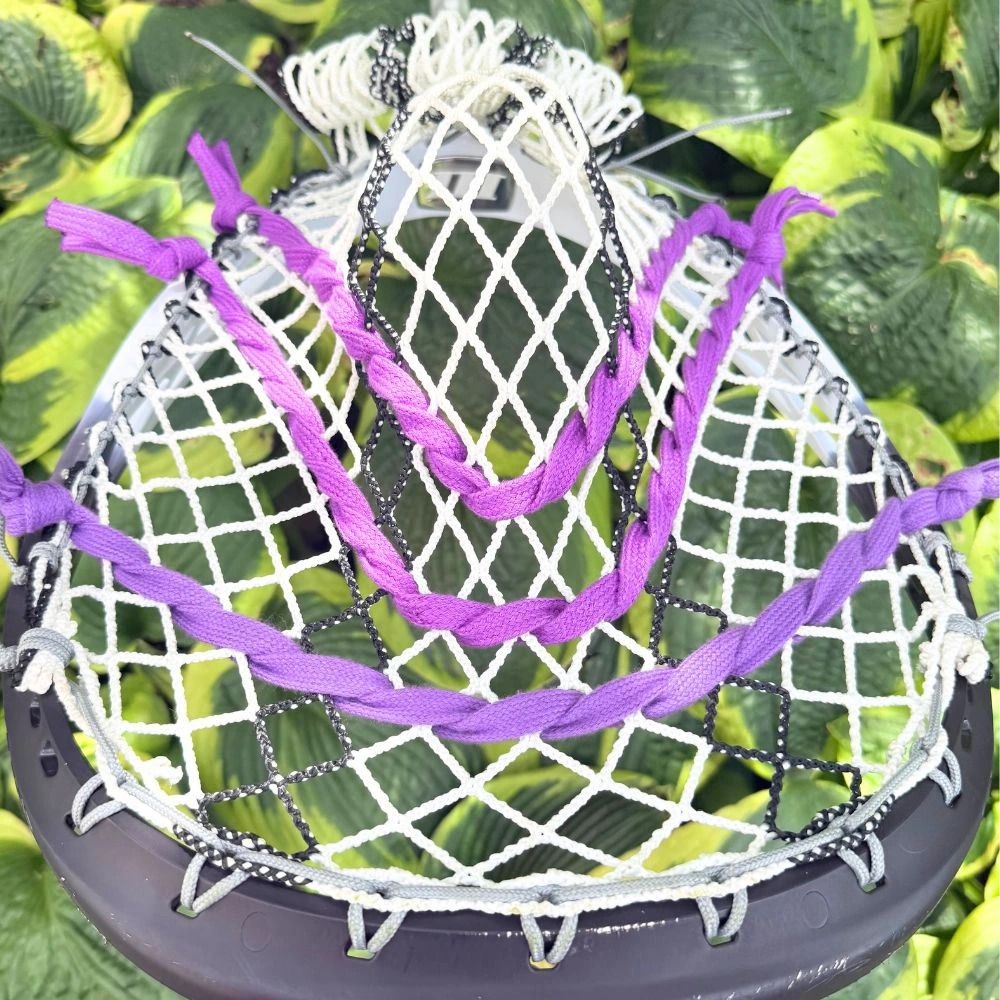 stx eclipse iii goalie head with ecd impact mesh, custom-strung with grey stringers shack top and bottom strings, grey laxroom sidewalls, and purple shooters