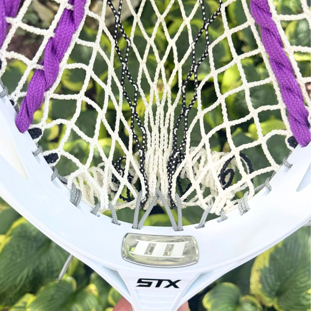 stx eclipse iii goalie head with ecd impact mesh, custom-strung with grey stringers shack top and bottom strings, grey laxroom sidewalls, and purple shooters