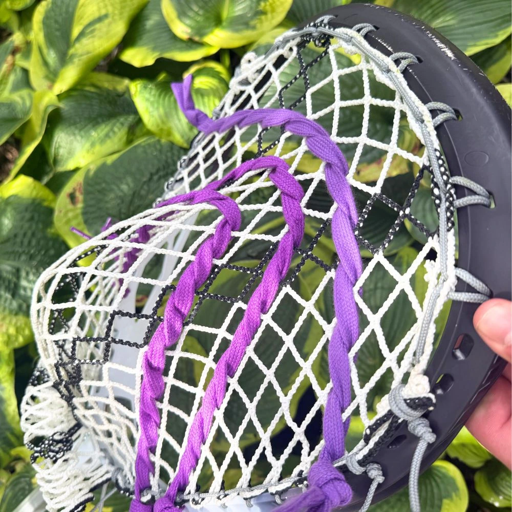 stx eclipse iii goalie head with ecd impact mesh, custom-strung with grey stringers shack top and bottom strings, grey laxroom sidewalls, and purple shooters