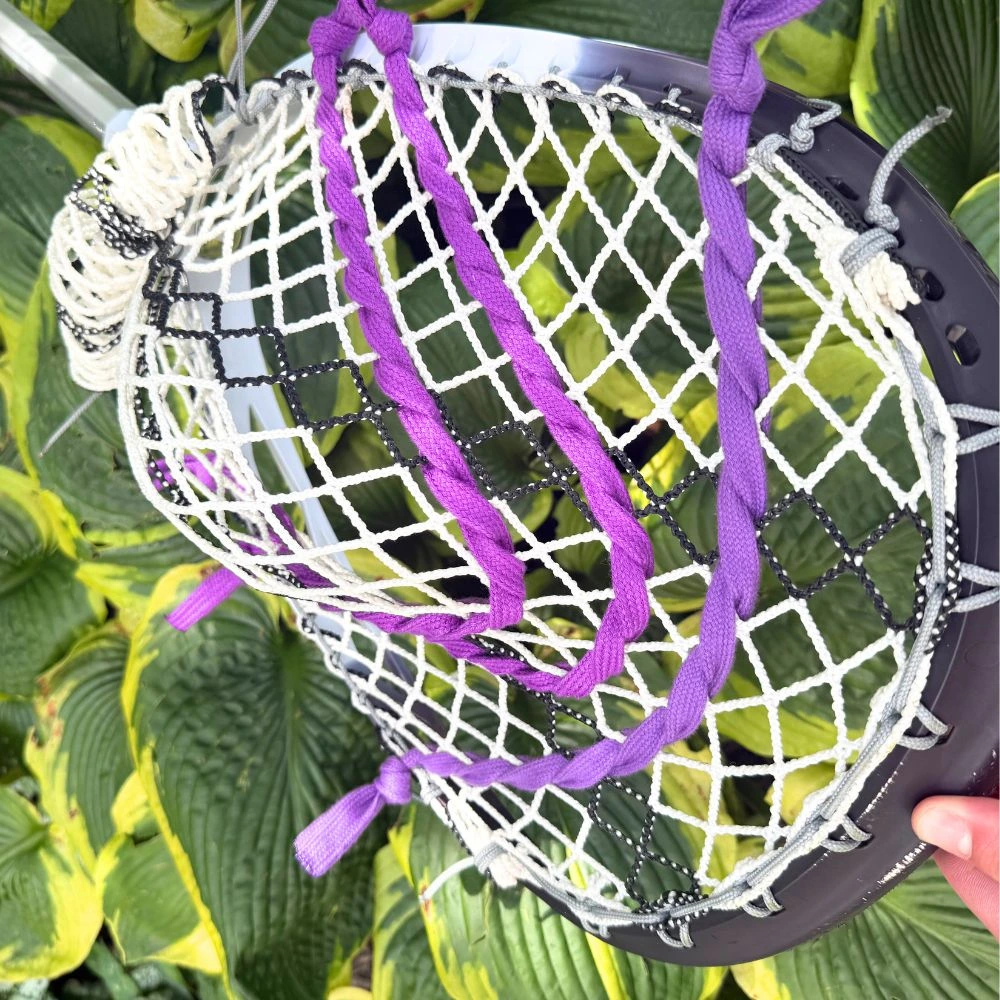 stx eclipse iii goalie head with ecd impact mesh, custom-strung with grey stringers shack top and bottom strings, grey laxroom sidewalls, and purple shooters