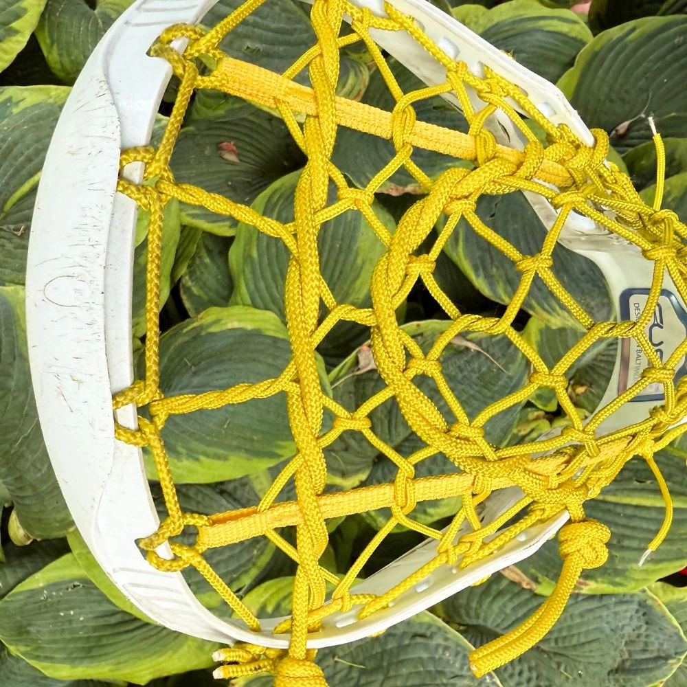 stx fuse with a broken in all yellow lock lacrosse pocket - channel view