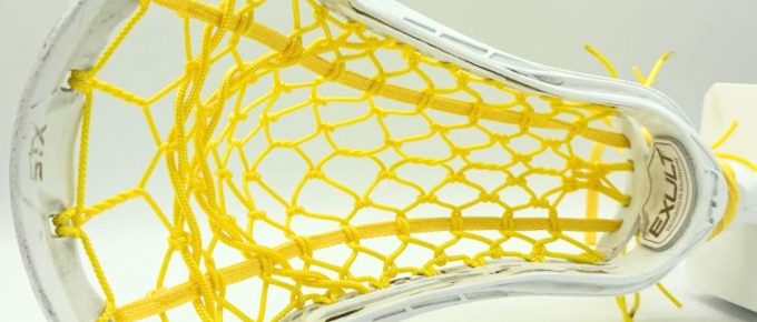 Lacrosse stick head with yellow strings