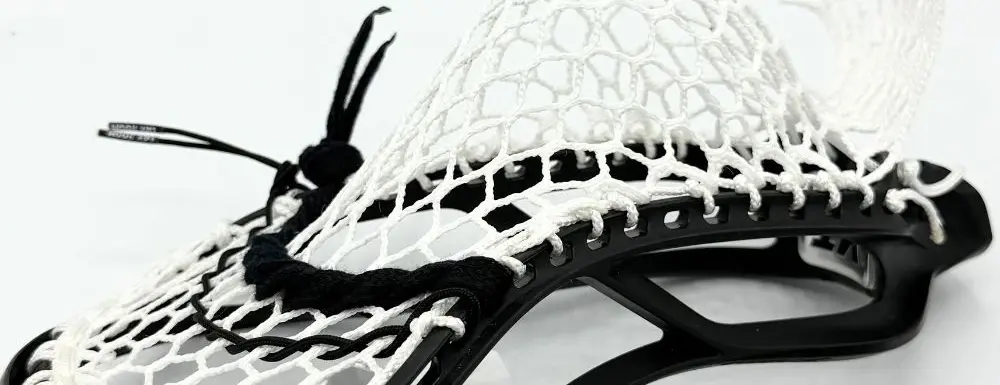 Lacrosse stick with white mesh pocket