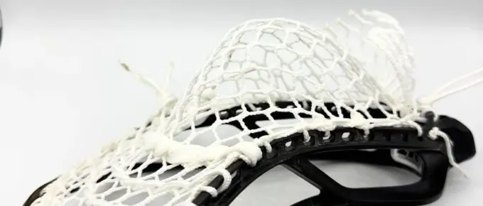 Lacrosse stick with white mesh pocket