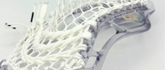 Lacrosse head with white stringing